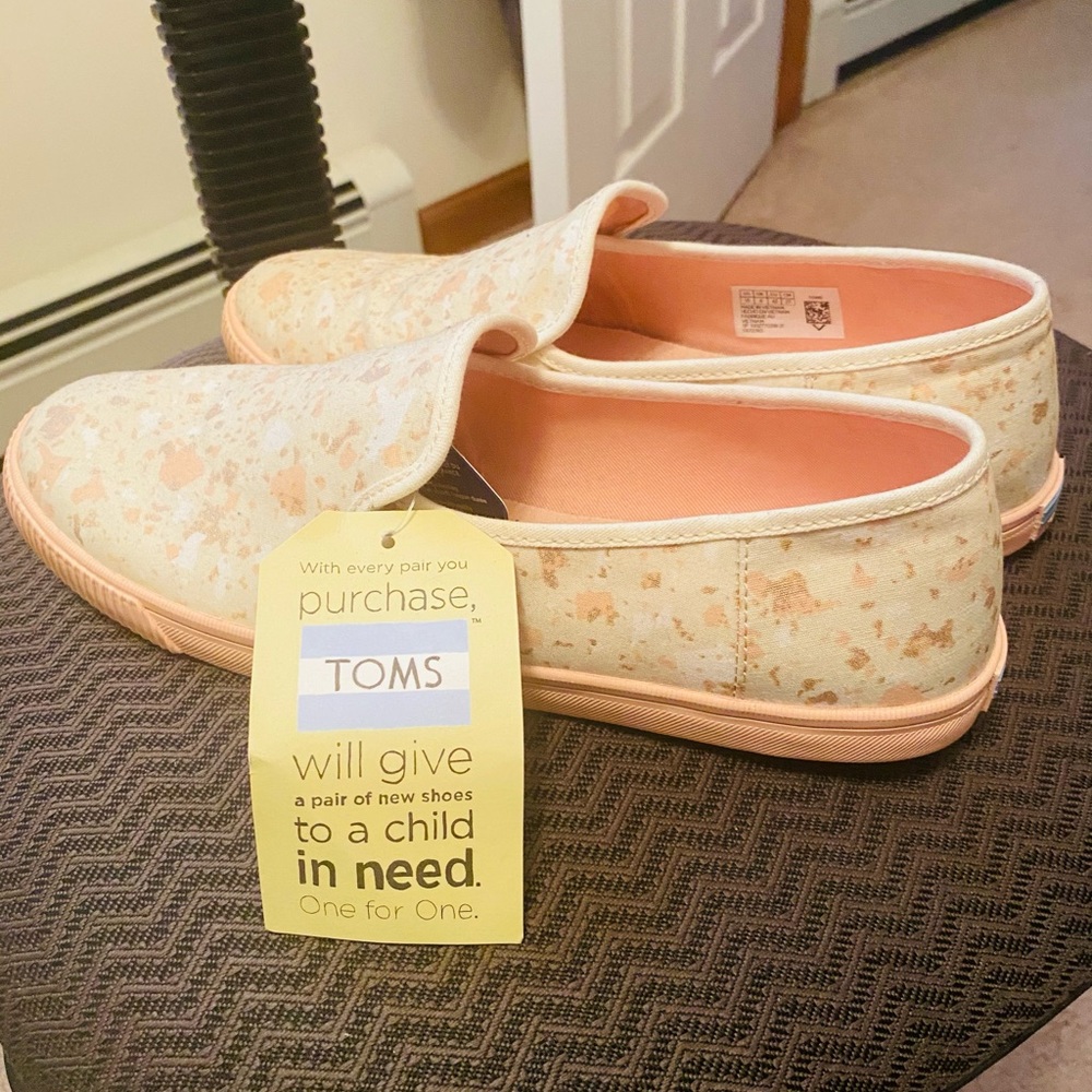 Brand new size 10 TOMS. Light pink and sparkle